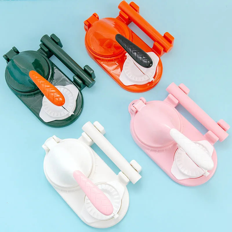 Plastic 3 in 1 dumpling maker with rolling pin and two props in white and green on a table
