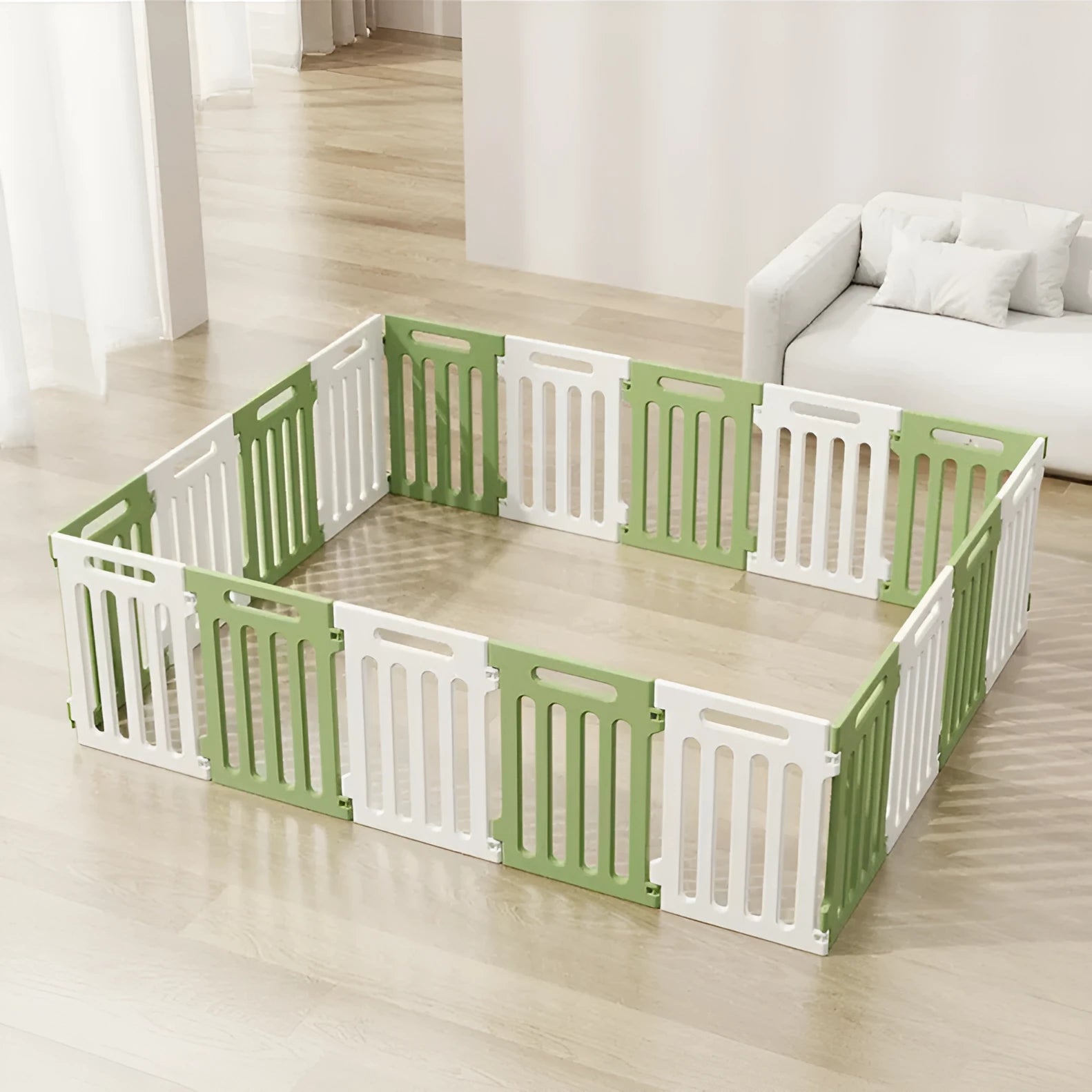 Plastic modular pet isolation fence panels assembled as indoor dog enclosure in white and green colour combination