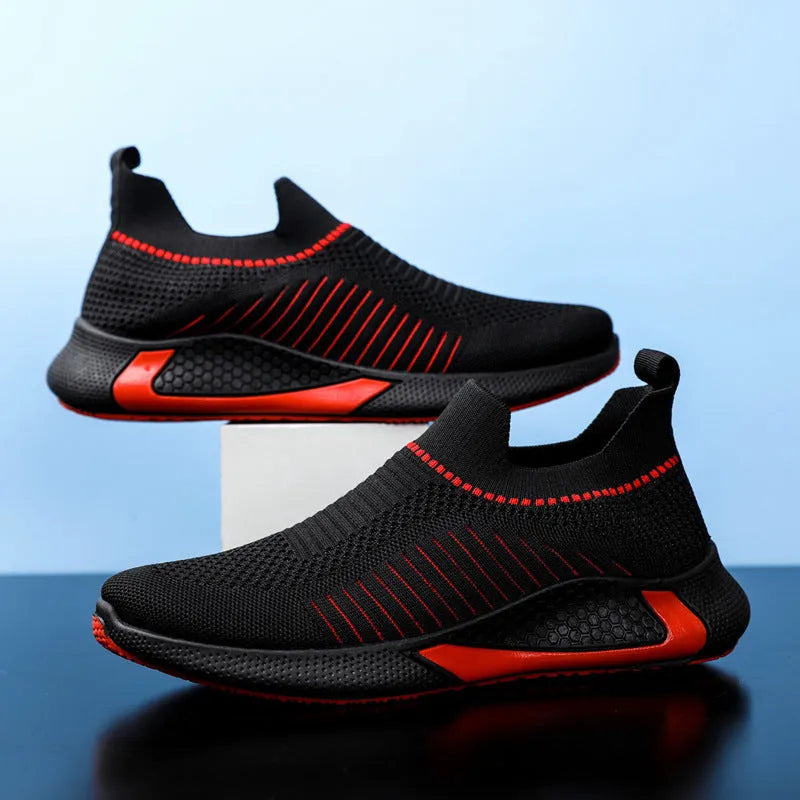 Men's low-cut sneakers with striped Flyknit upper, mesh lining, and flat plastic sole.
