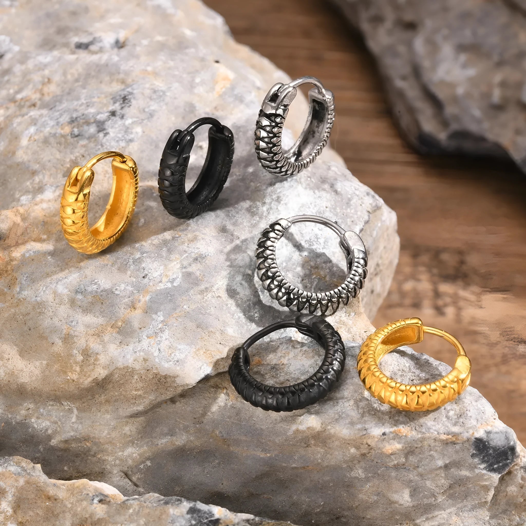 Stainless steel snake pattern stud earrings in black and gold colour options