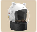 Winter electric bike helmet with attached blue scarf and clear anti-fog visor shown on a bicycle handlebar.