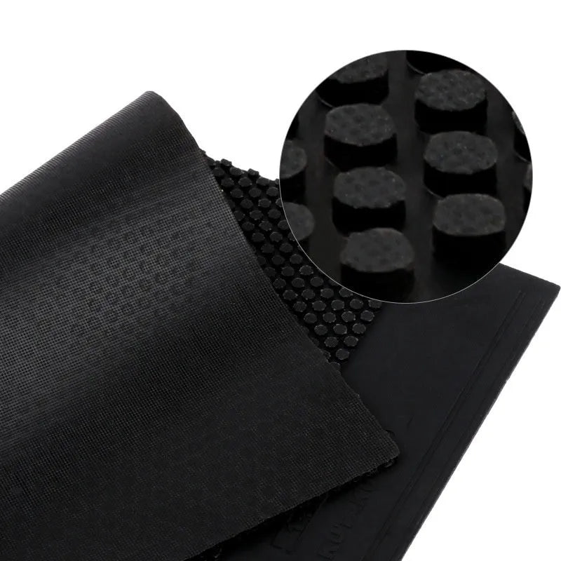 Single sheet of black raw table tennis rubber with a small particle textured surface.