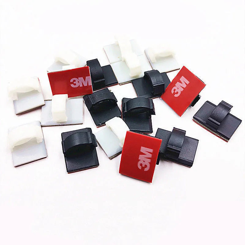 Black and white self-adhesive plastic buckles for organising flat car wiring cables