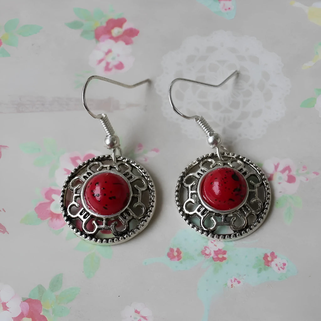 Handmade Miao silver ethnic earrings with turquoise on a retro flower disk design.