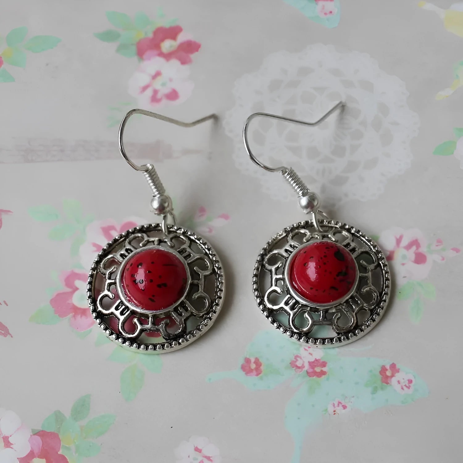 Handmade Miao silver ethnic earrings with turquoise on a retro flower disk design.