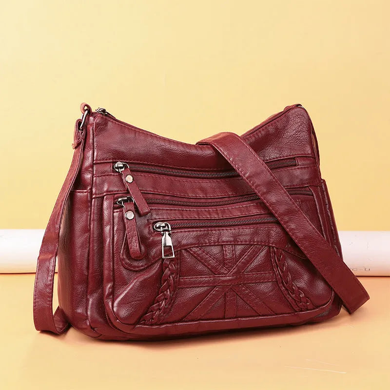 Soft PU casual messenger bag with multi-layer multi-pocket design in black colour