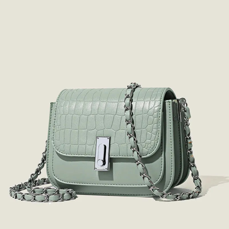 Soft PU women's fashion shoulder bag in horizontal square shape with phone compartment.