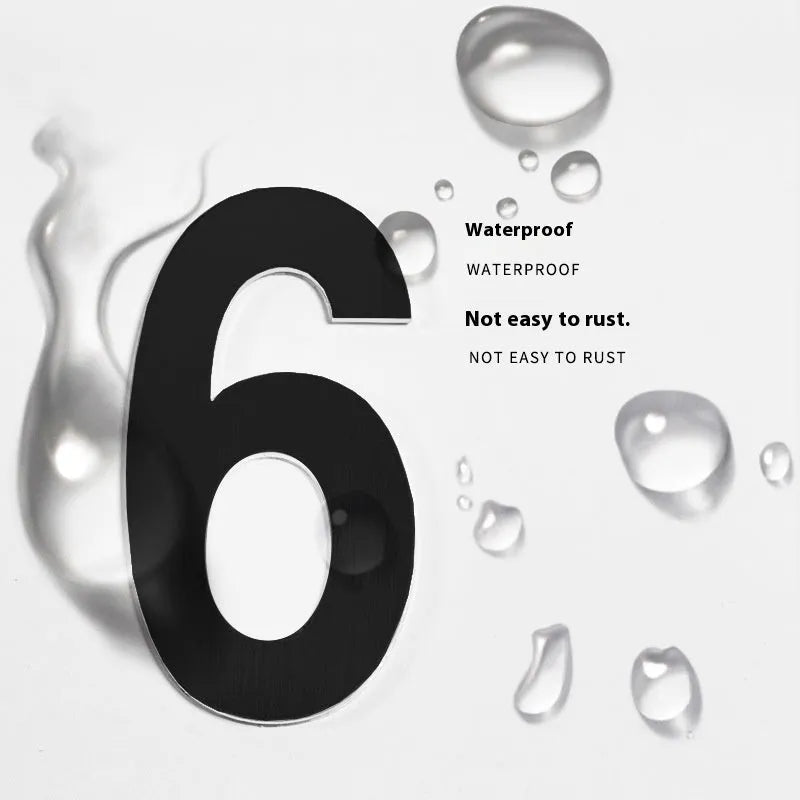 Black stainless steel sticky house number showing the digit 7, 7.5cm in size
