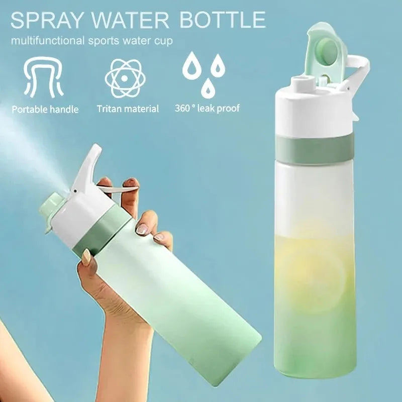White plastic spray water bottle with handle strap and leakproof lid on a gym bag.