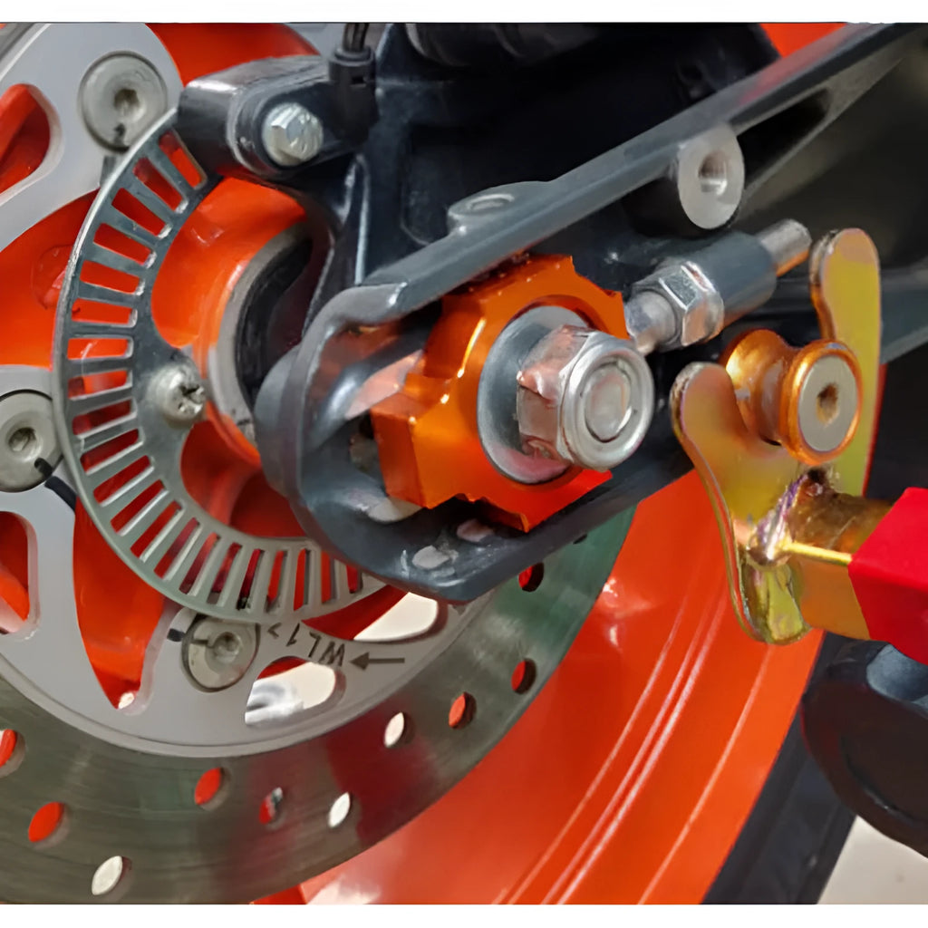 Orange anodised aluminium adjuster screws for KTM DUKE motorcycle rear forks
