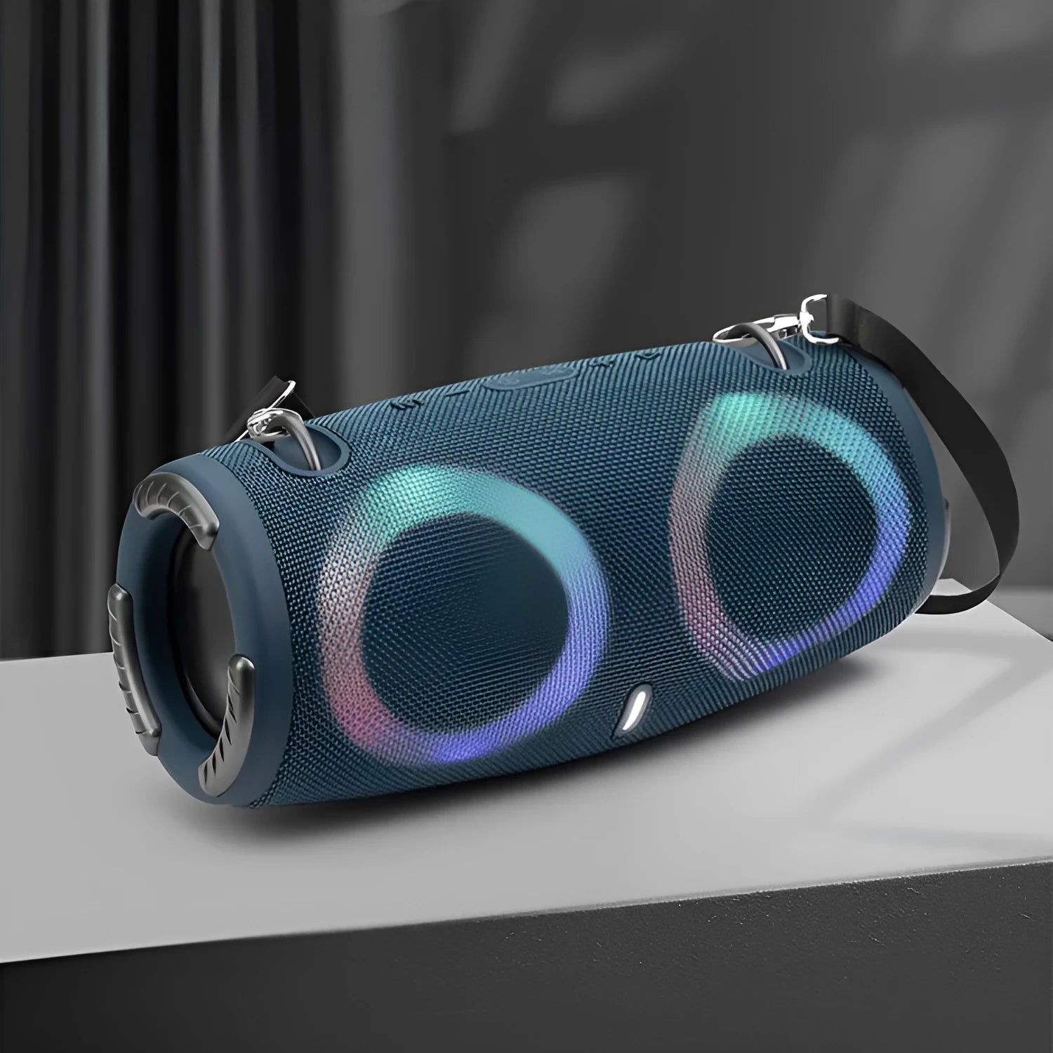 War Drum portable Bluetooth speaker with coloured RGB lights in camouflage colour, showing carrying strap and control buttons.