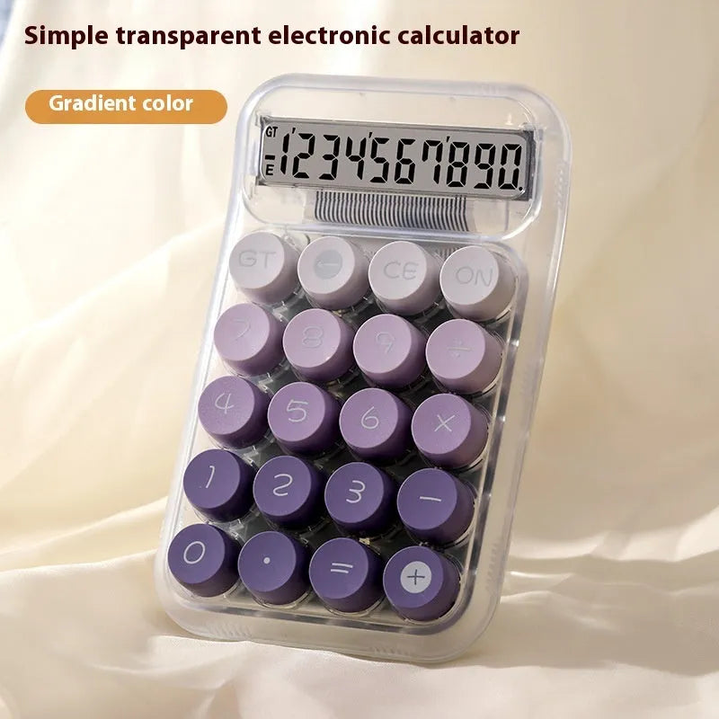 Gradient colour round mechanical keyboard calculator in muted blue, green, pink, or purple on a desk.