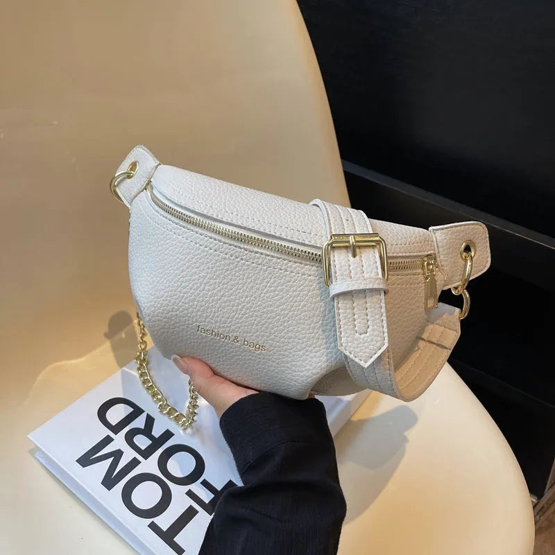 Waist bag with single shoulder design, PU material, medium soft texture, zippered compartment, splicing detail, available in black pink white colours.