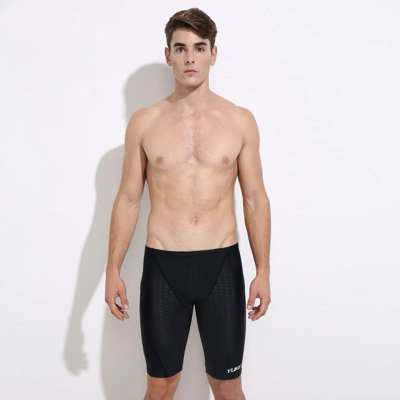 Men's complete swimming set showing briefs, anti-fog goggles, waterproof cap, ear plugs with nose clip, and swimming bag
