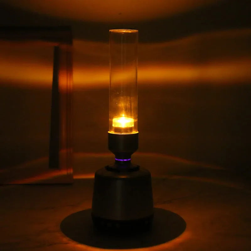 White silver candlelight Bluetooth speaker and LED night light with modern design.