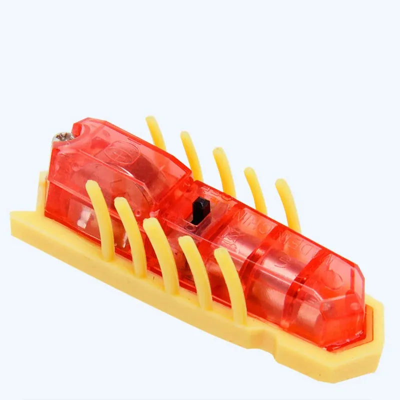 Mini electric bug cat toy with 12 angular legs in insect shape on flat surface