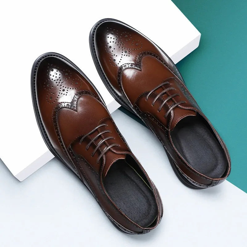 Men's black brogue formal shoes with a lace-up front and perforated detail.