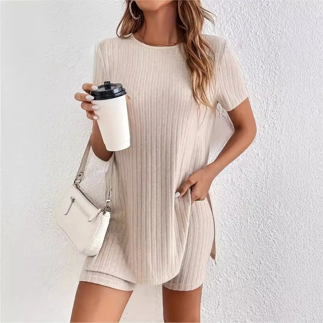 Women's grey ribbed cotton two-piece pyjama set with crew neck top and shorts on a hanger.
