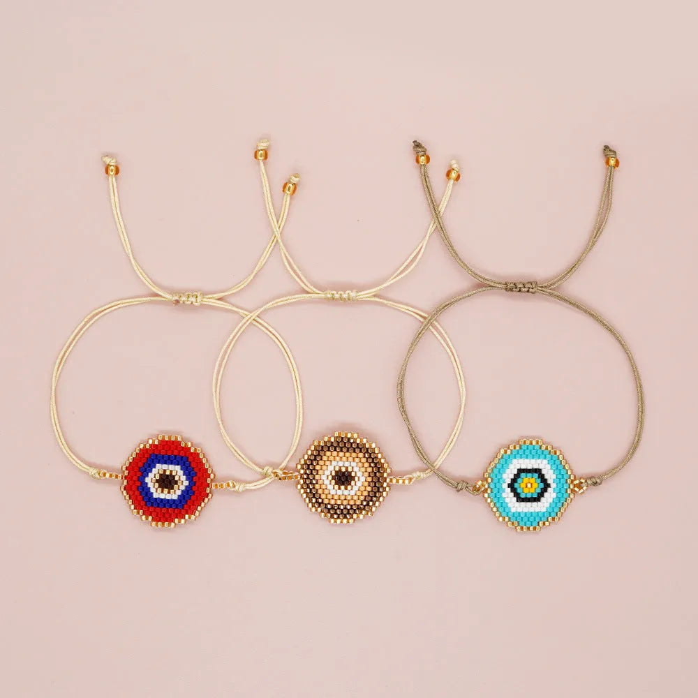 Hand-woven devil's eyes glass bead bracelet with blue eye detail in chic style for women