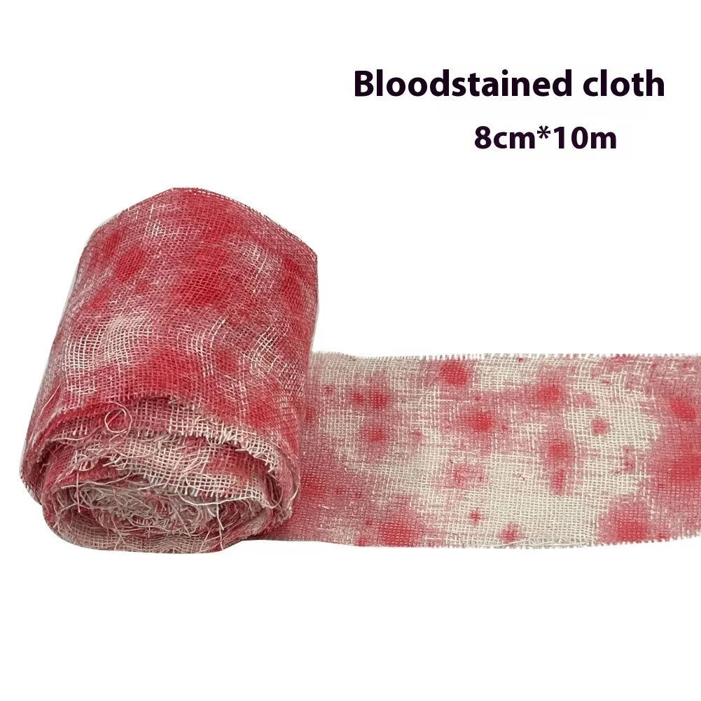 Roll of 8cm wide bloody red Halloween bandage gauze for horror decoration next to a white variant.