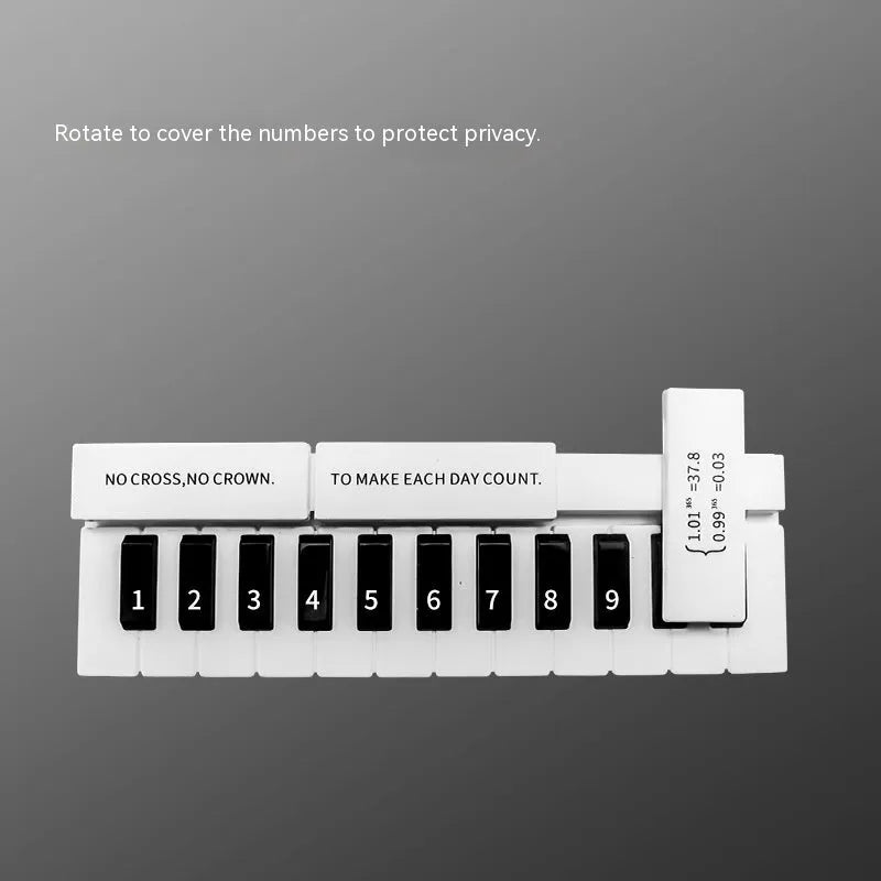 Black and white piano-shaped plastic parking sign measuring 148mm wide