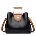 Women's barrel crossbody shoulder bag in soft PU with zip pocket and document pocket, shown in one of six colours