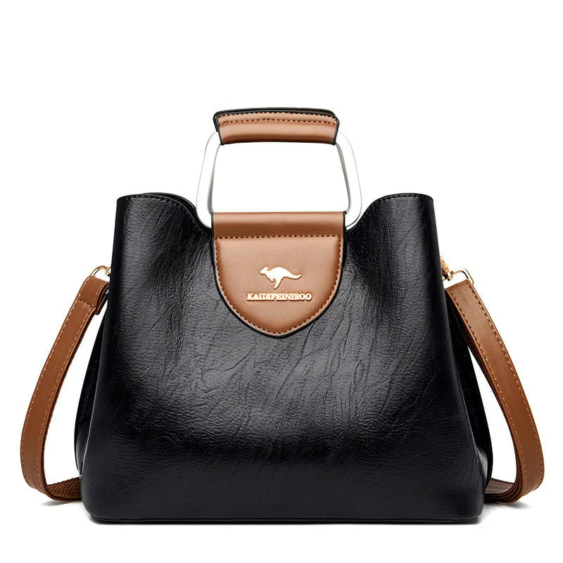 Women's barrel crossbody shoulder bag in soft PU with zip pocket and document pocket, shown in one of six colours