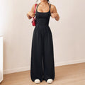 Women's casual jumpsuit with elastic waist and side pockets in black, navy, gray, and burgundy colour options