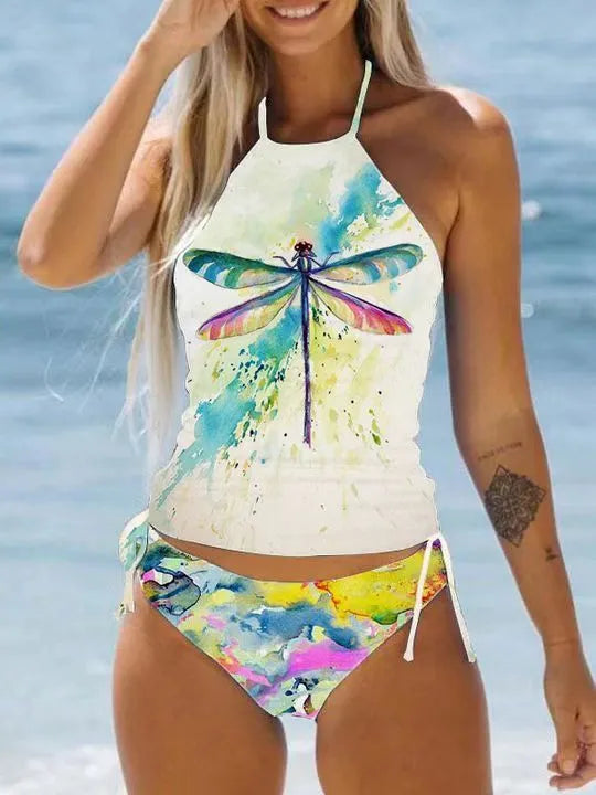 Conservative style women's swimsuit with colourful cartoon print and matching shorts.
