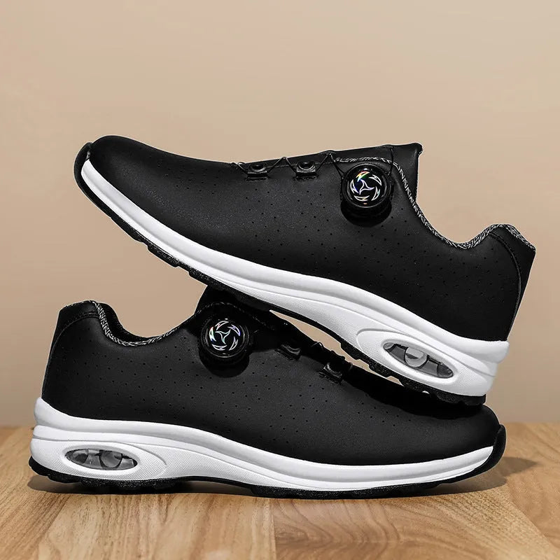 Black and white low-top mesh casual tennis shoes with cross shoulder straps and a flat sole.