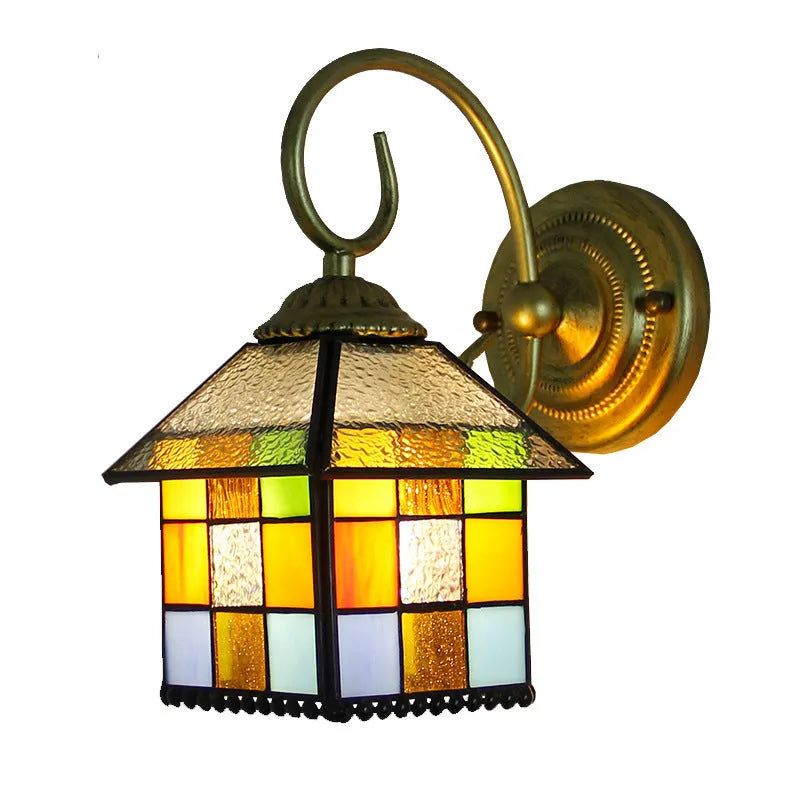 A coloured stained glass wall lamp in a simple contemporary style, mounted on a wall.