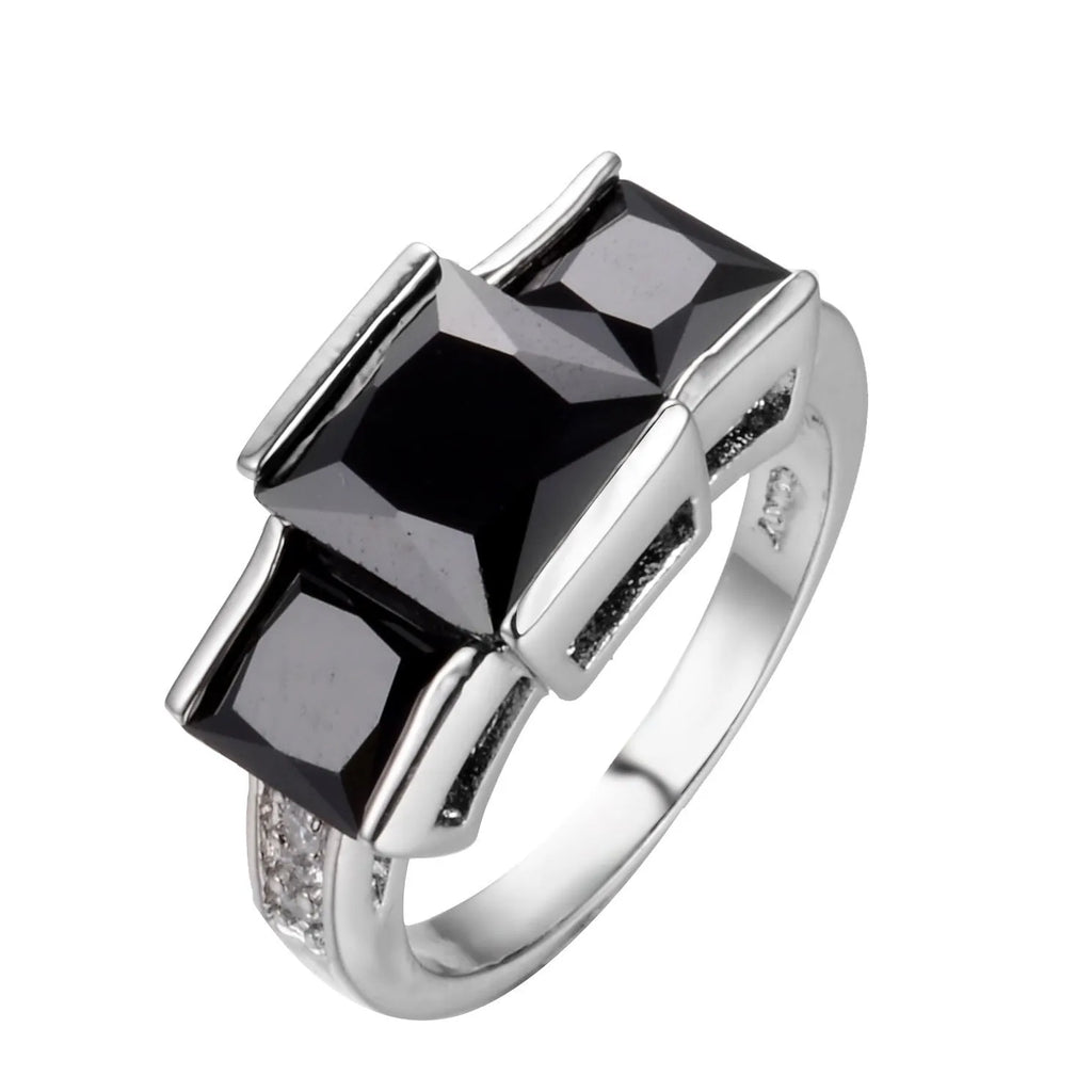 Colourful women's metal ring in copper with electroplated finish, showing geometric and rainbow design.