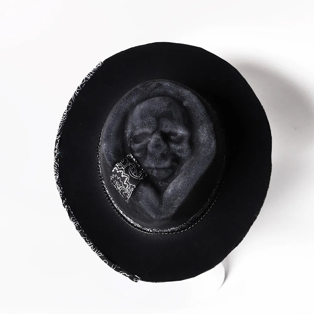 Handmade black wool felt skull hat with a tall pointed conical crown for Halloween costumes.