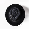 Handmade black wool felt skull hat with a tall pointed conical crown for Halloween costumes.