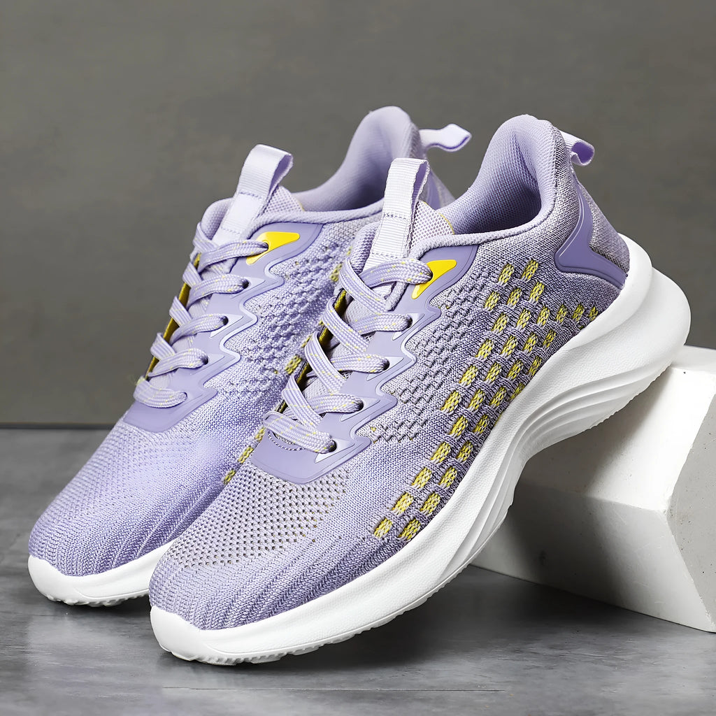 Women's lavender purple Flyknit running shoes with mesh upper and EVA sole on a white background.