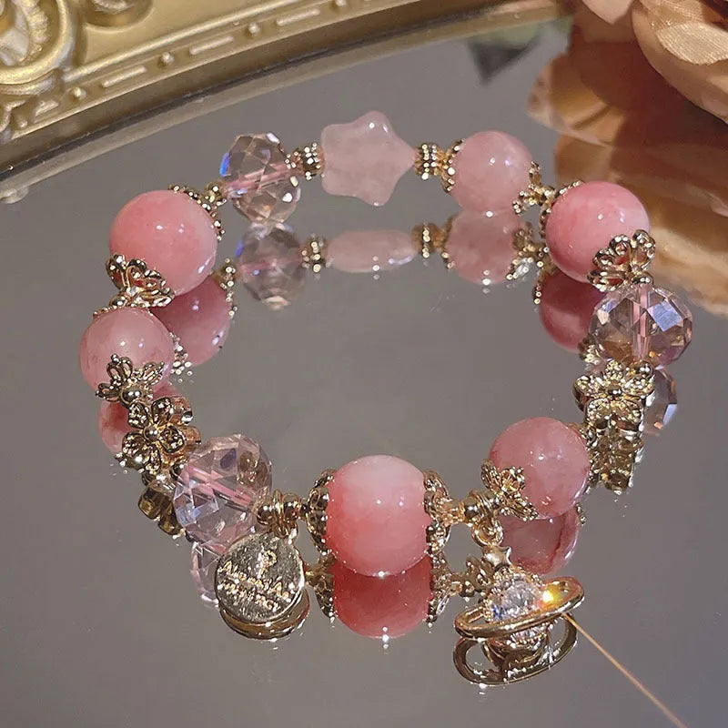 Galaxy-coloured women's bracelet with snowflake pendant, bow, and heart designs
