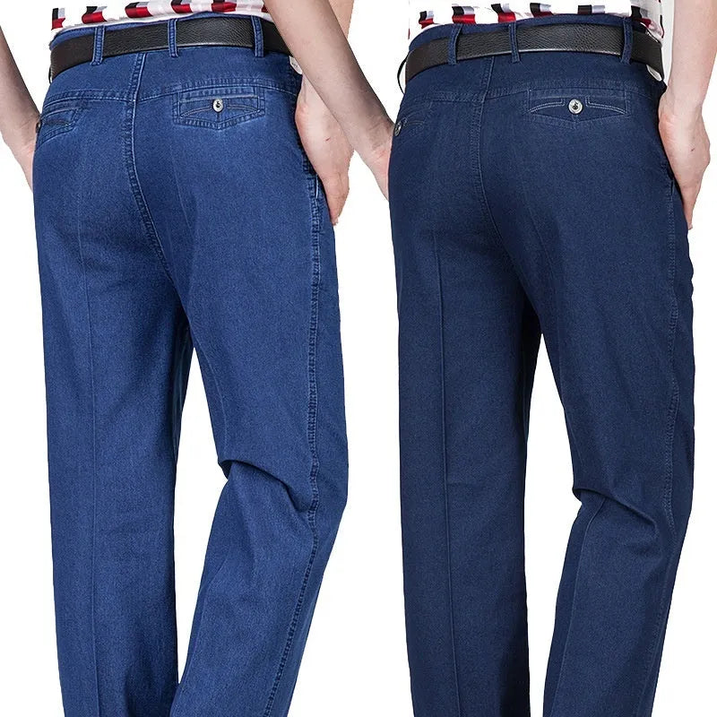 Men's high-waist loose fit blue denim trousers on a hanger, showing the casual cut and zipper fly.