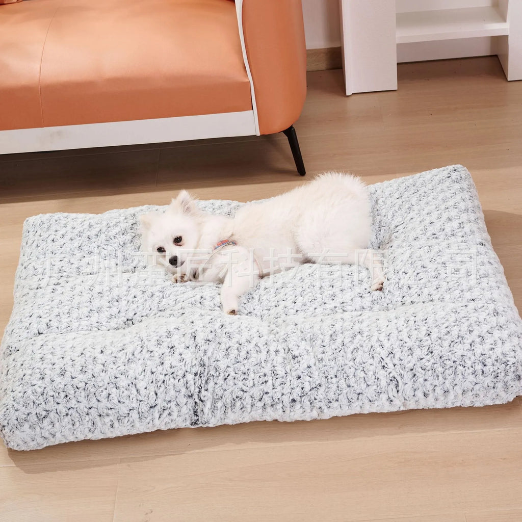 Light gray embossed velvet dog bed for small to large pets on a wooden floor