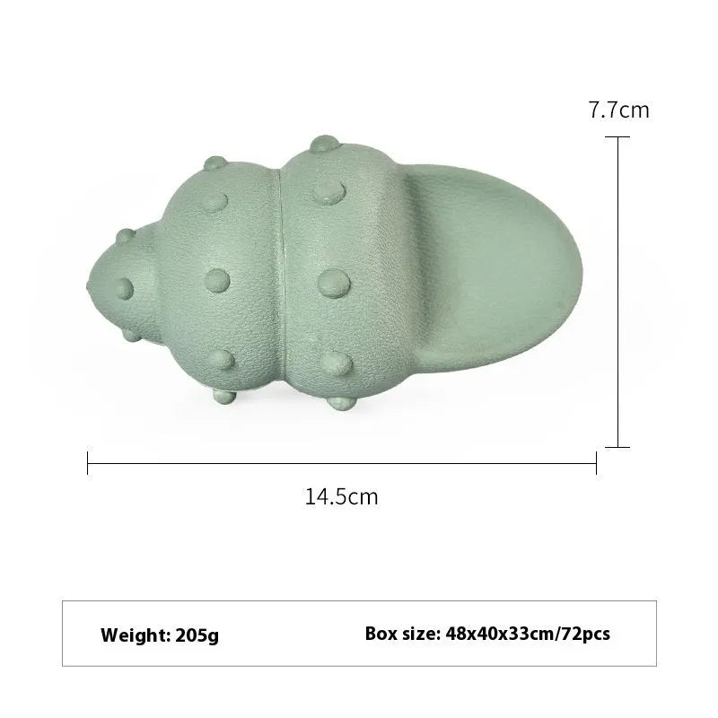Blue and green shark-shaped rubber dog chew toy on a white background.