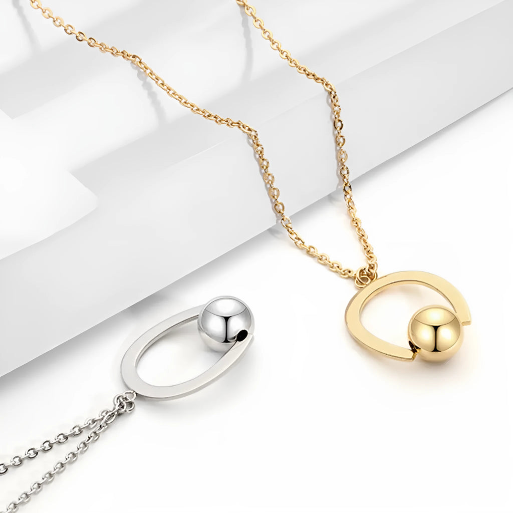 Gold or silver adjustable stainless steel necklace with a geometric pendant on a cross chain.