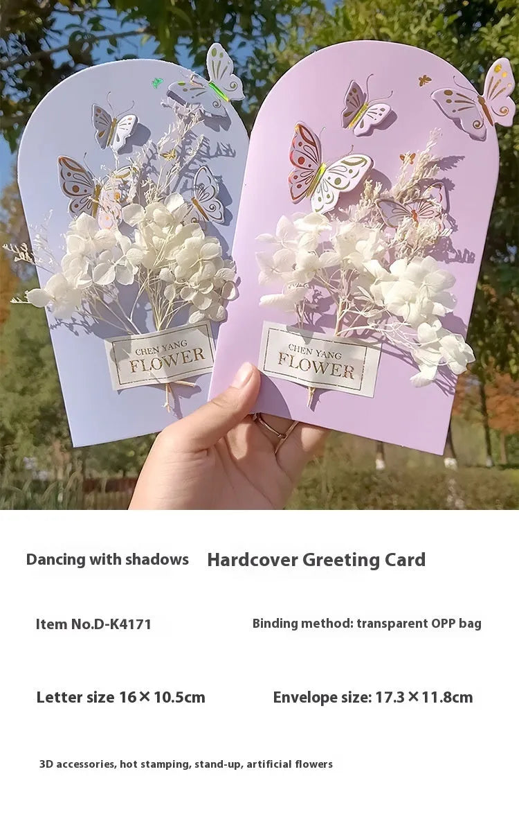 Handmade 3D boxed birthday card with butterfly shape and artificial flowers.