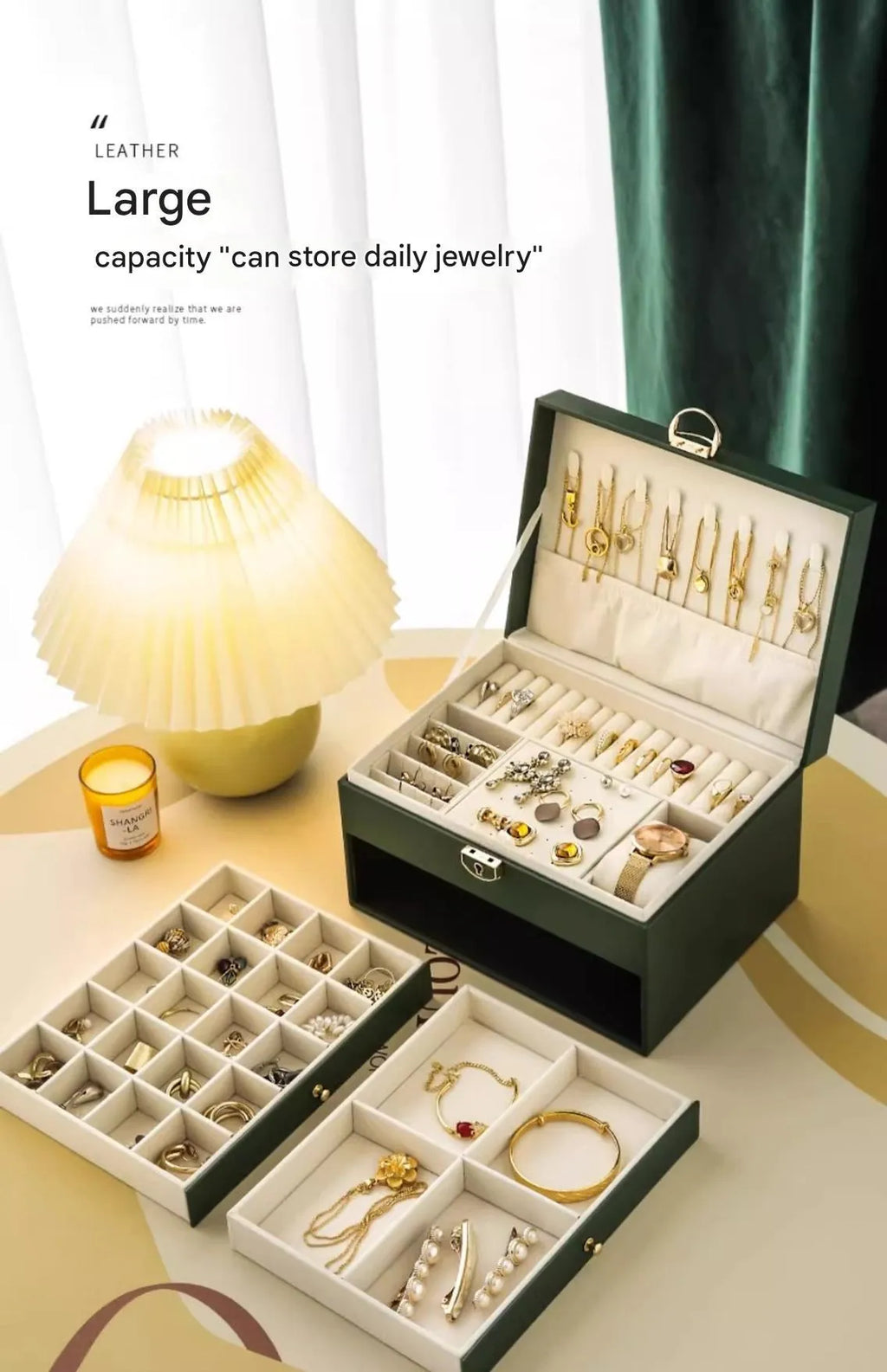Leather jewellery box with three drawers open, showing storage for necklaces, earrings and bracelets.