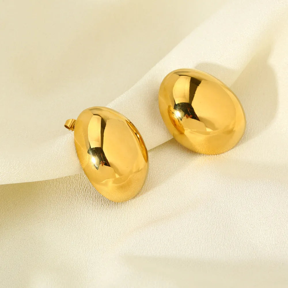 Geometric ear studs with electroplated 18K gold finish and line pattern detailing