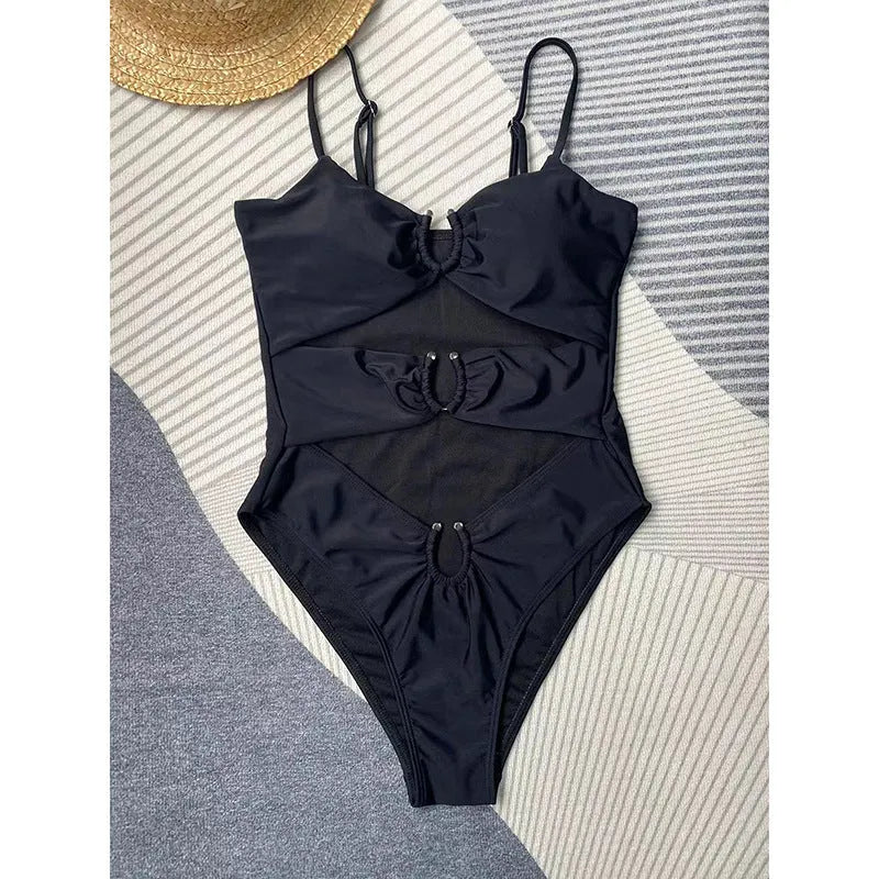 Solid black one-piece swimsuit for women on a mannequin.