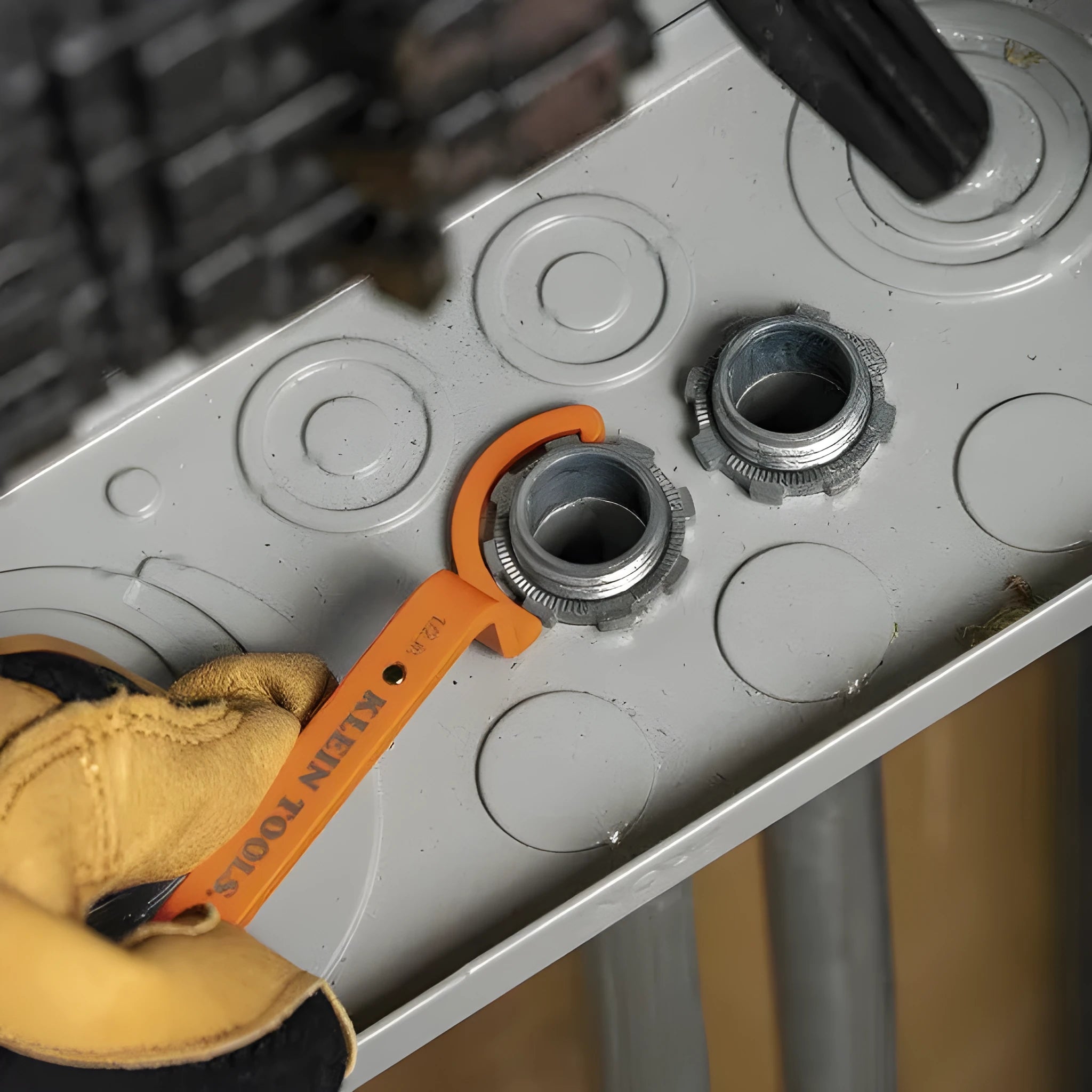Orange, grey, and black magnetic crescent wrenches with catheter locking, shown together as a three-piece set.