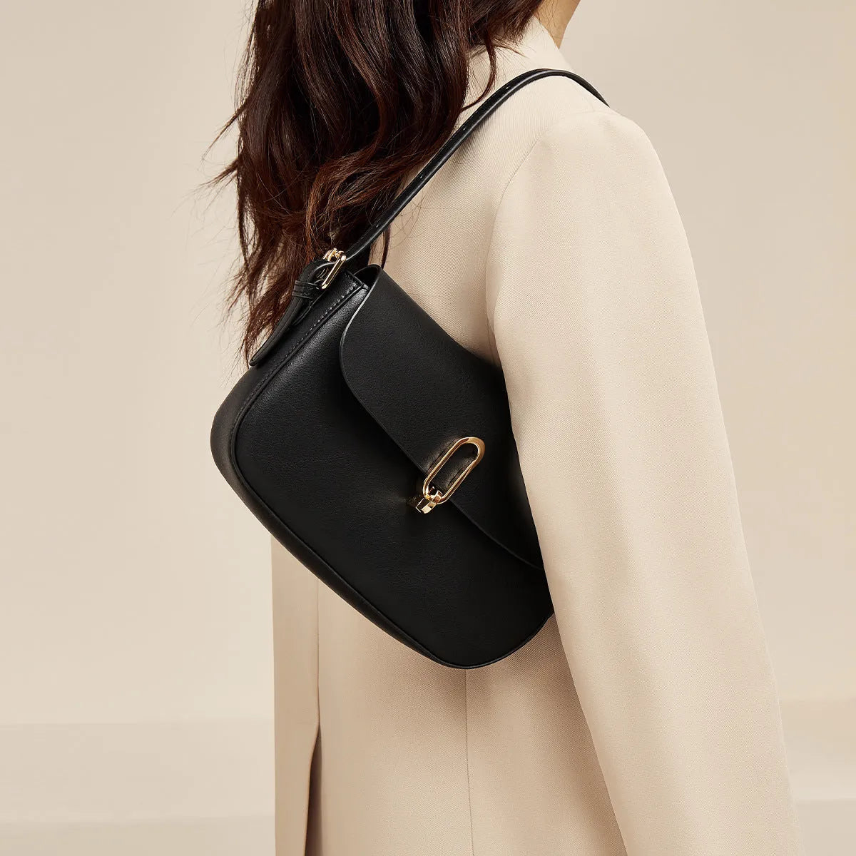 Black genuine leather square messenger bag with shoulder strap and lock closure
