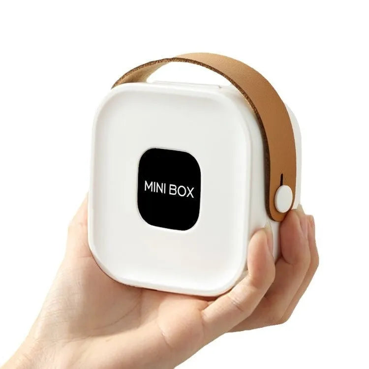 Medium-sized solid colour portable storage box for organising data cables and a Bluetooth headset.