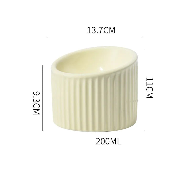 Elevated ceramic cat bowl in light green colour with tilted round design for comfortable feeding