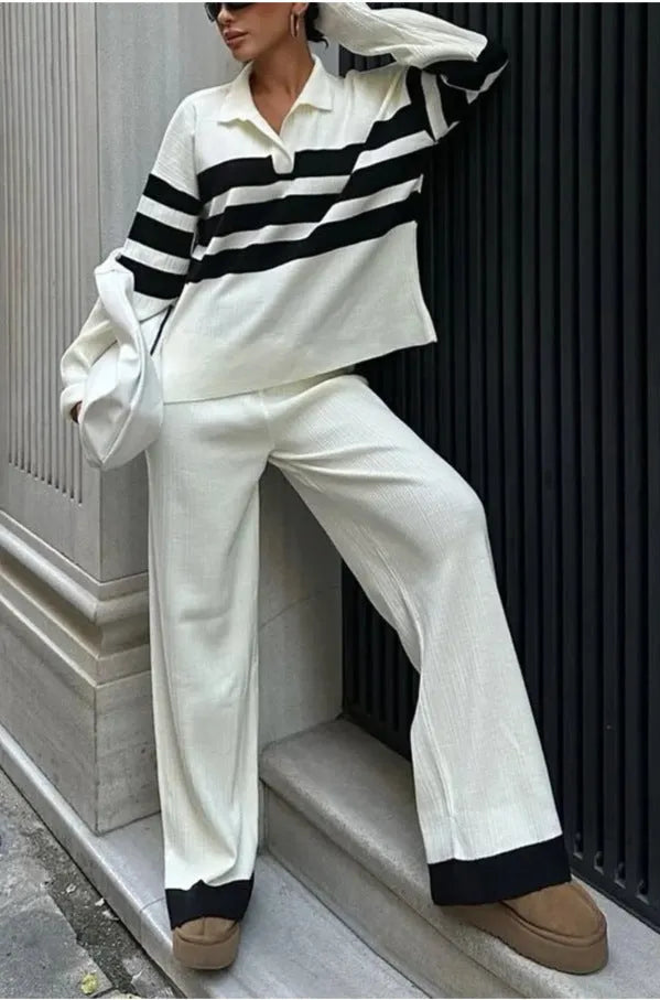 Women's black and white striped knitted polo collar two-piece set with long sleeves and trousers.