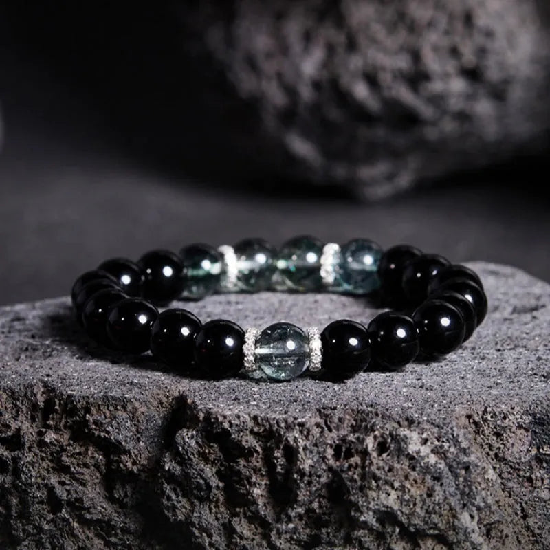 Chinese style black geometric bead bracelet with sterling silver components on wrist